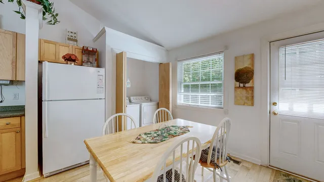 a view of house with outdoor seating and yard