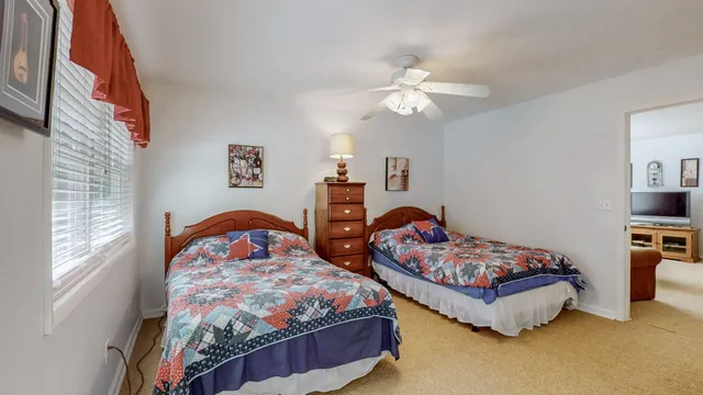 a view of a house with swimming pool and a yard