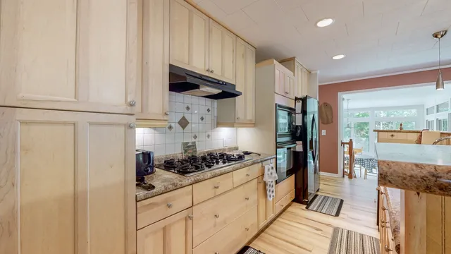 a living room with fireplace furniture and a fireplace