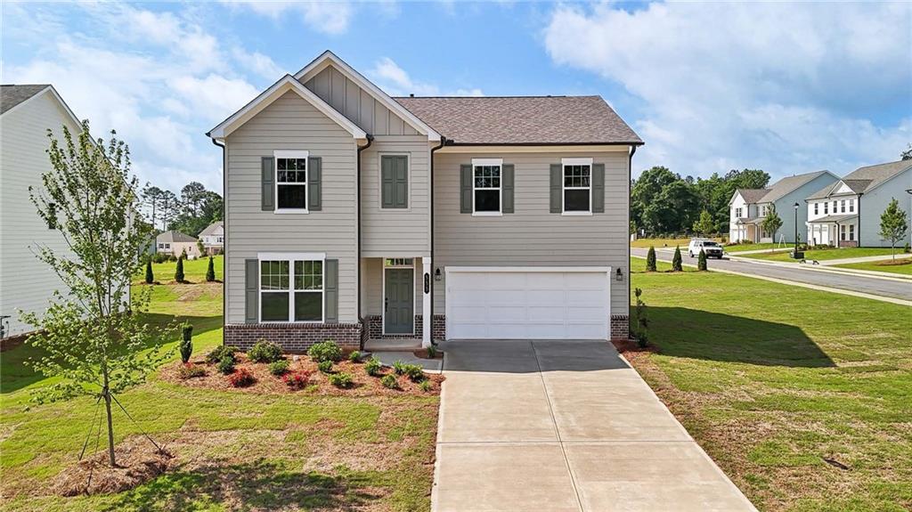 555 Silverleaf Trail Bethlehem, GA 30620 - Photo 1 of 1 a front view of a house with garden