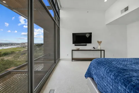 a spacious bathroom with a tub sink and mirror