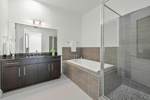 a bathroom with a shower and a sink