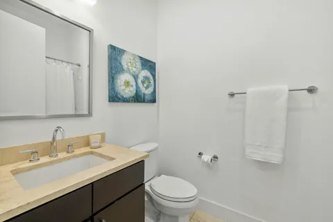 a bedroom with double bed and a window