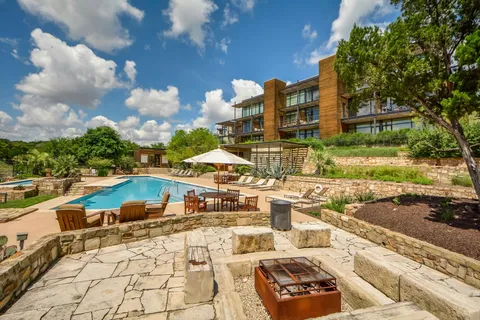 an aerial view of a house with outdoor space