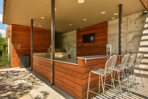 an outdoor space with furniture and city view