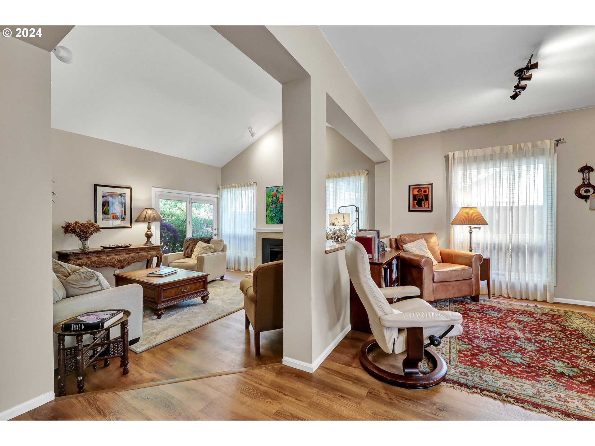 1281 Spyglass Drive Eugene, OR 97401 - Photo 11 of 37 a living room with furniture a rug and white walls