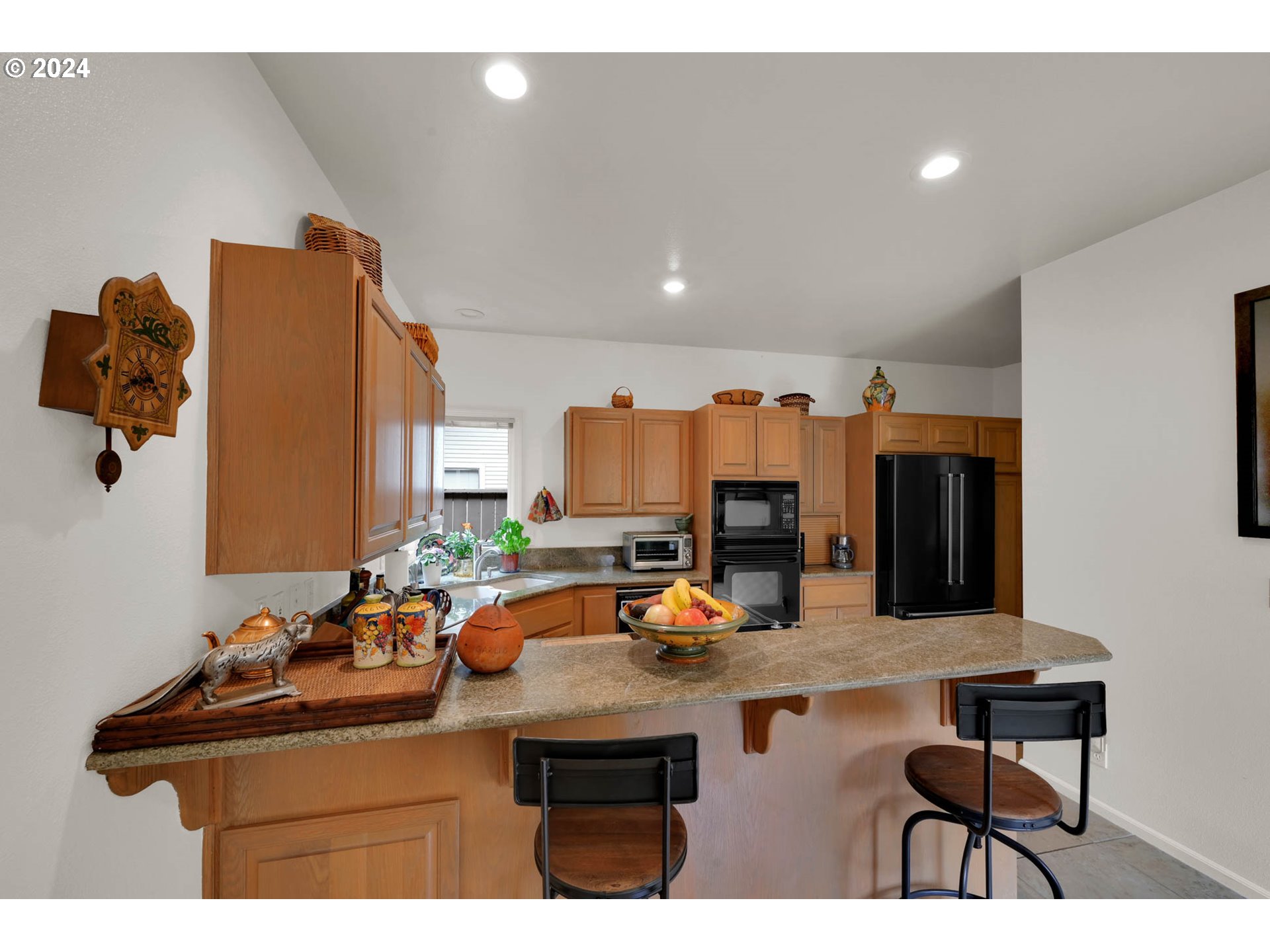 1281 Spyglass Drive Eugene, OR 97401 - Photo 15 of 37 a kitchen with a sink cabinets and window