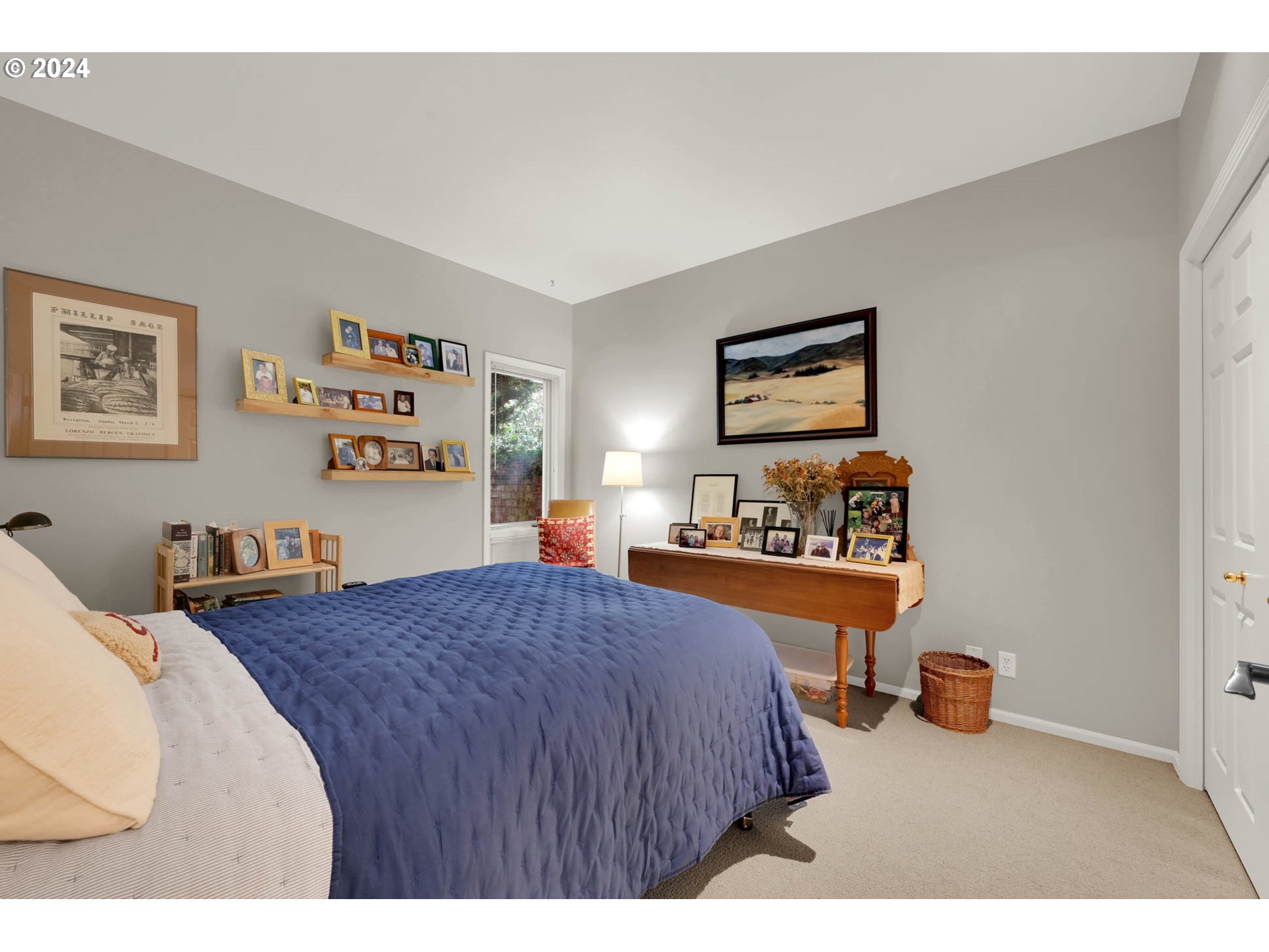 1281 Spyglass Drive Eugene, OR 97401 - Photo 27 of 37 a bedroom with a bed and a painting on the wall