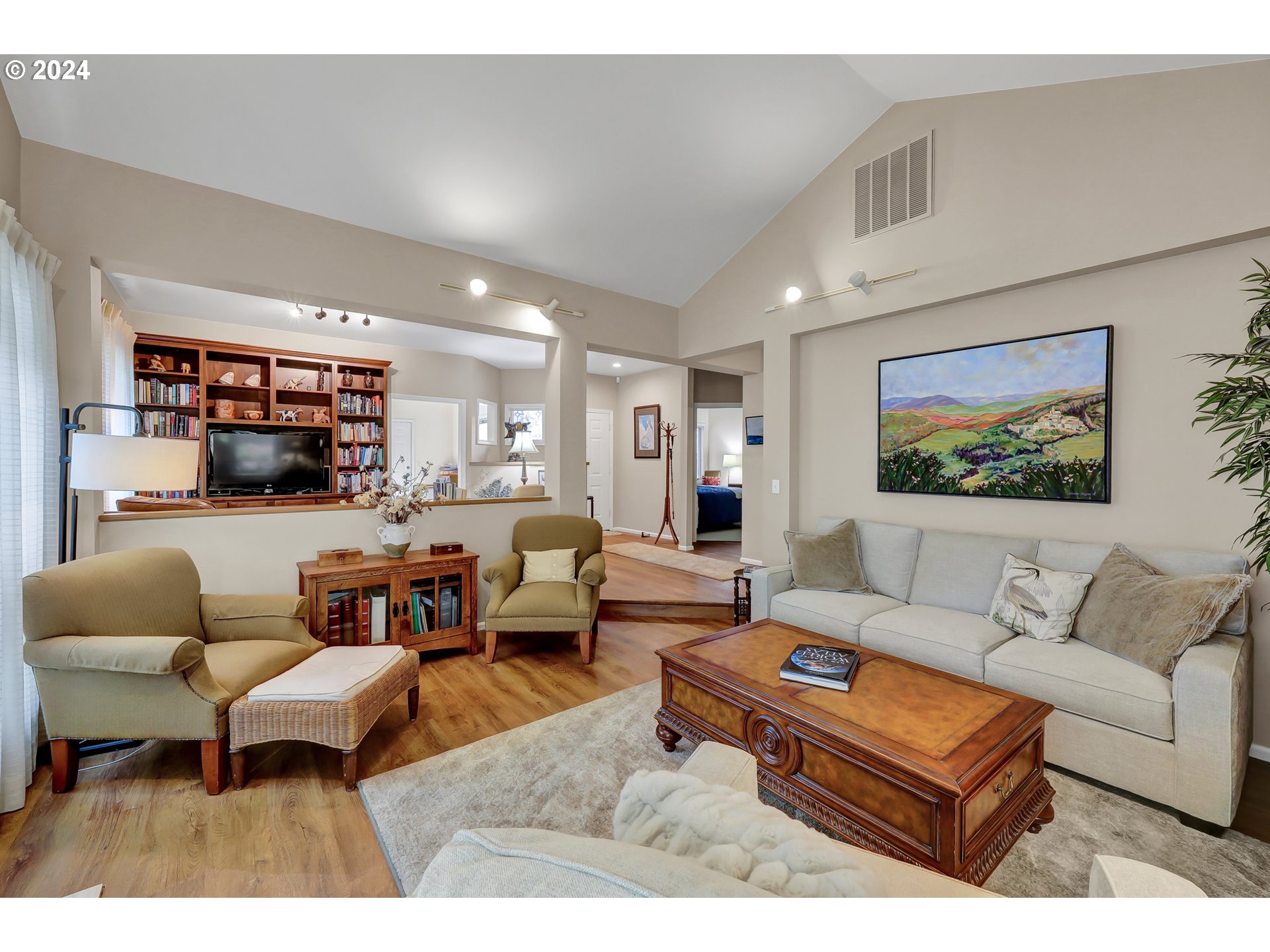 1281 Spyglass Drive Eugene, OR 97401 - Photo 8 of 37 a living room with furniture and a flat screen tv