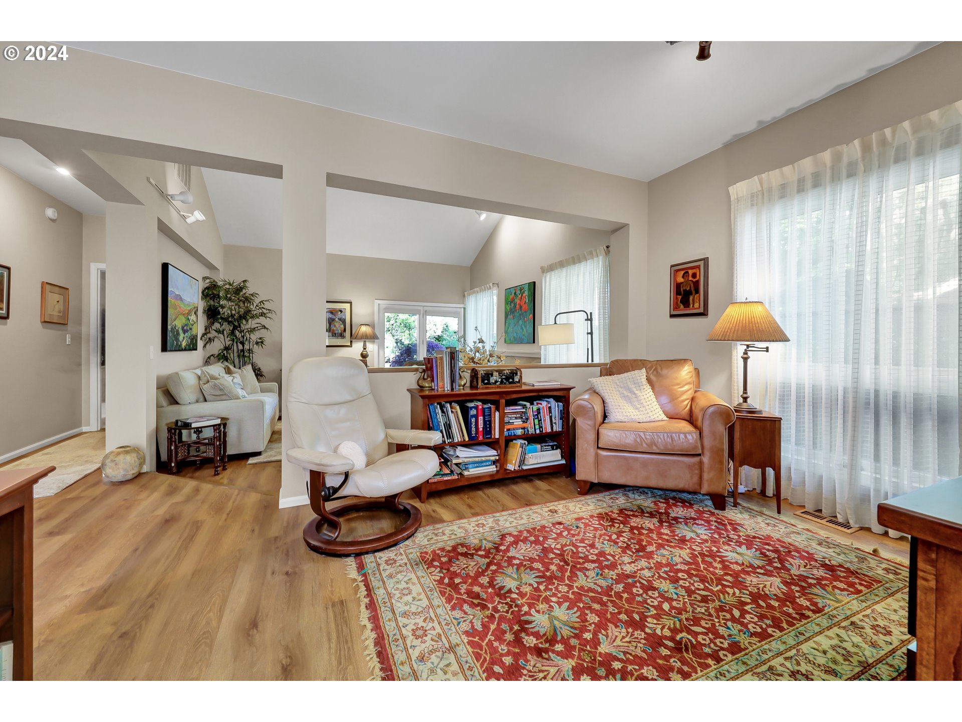 1281 Spyglass Drive Eugene, OR 97401 - Photo 9 of 37 a living room with furniture and a wooden floor