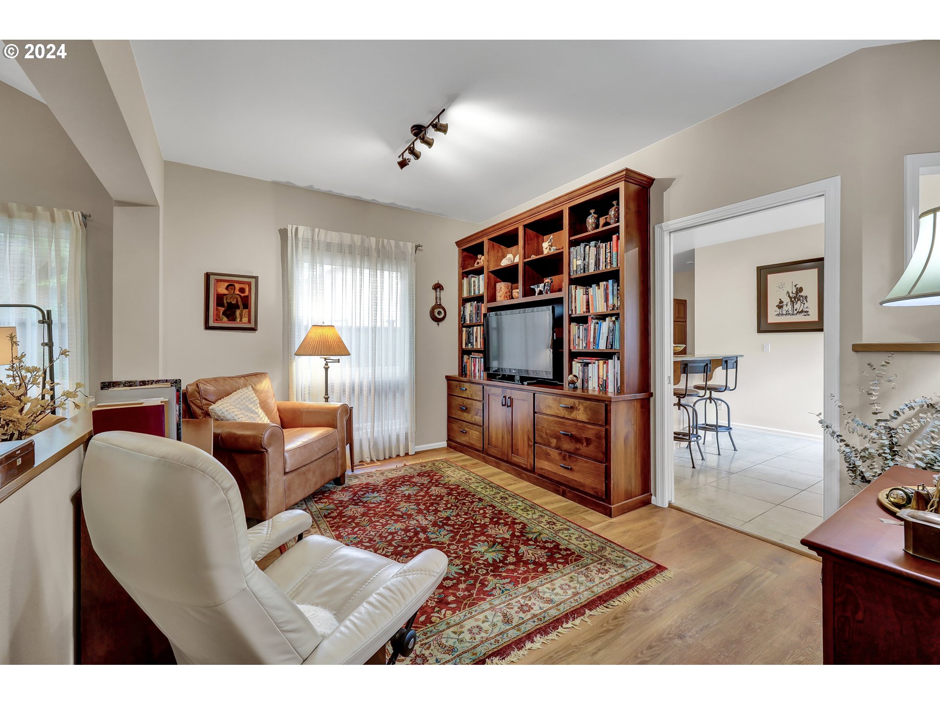 1281 Spyglass Drive Eugene, OR 97401 - Photo 10 of 37 a living room with furniture and a book shelf