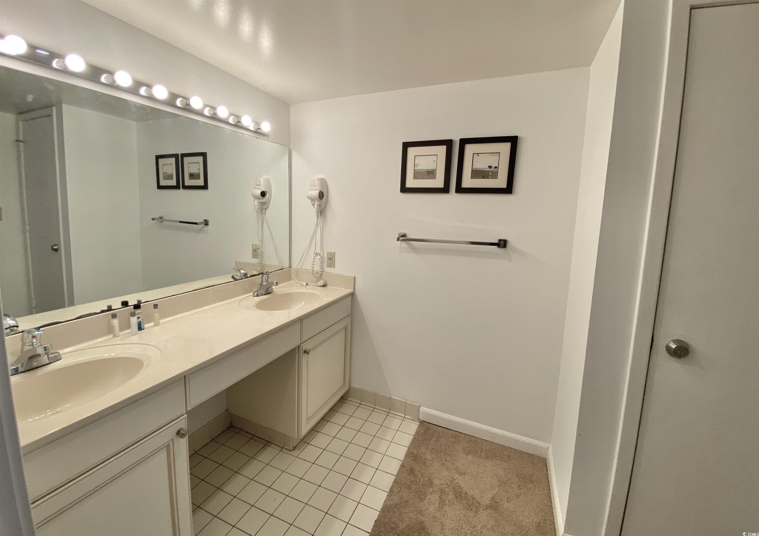9820 Queensway Boulevard, Unit 206 Myrtle Beach, SC 29572 - Photo 21 of 40 Bathroom with tile patterned floors and vanity