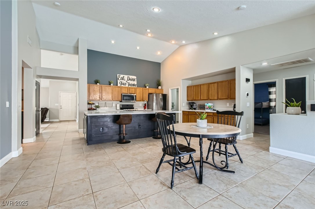 8920 Rusty Rifle Avenue Las Vegas, NV 89143 - Photo 5 of 37 View of dining area open to kitchen and family room.