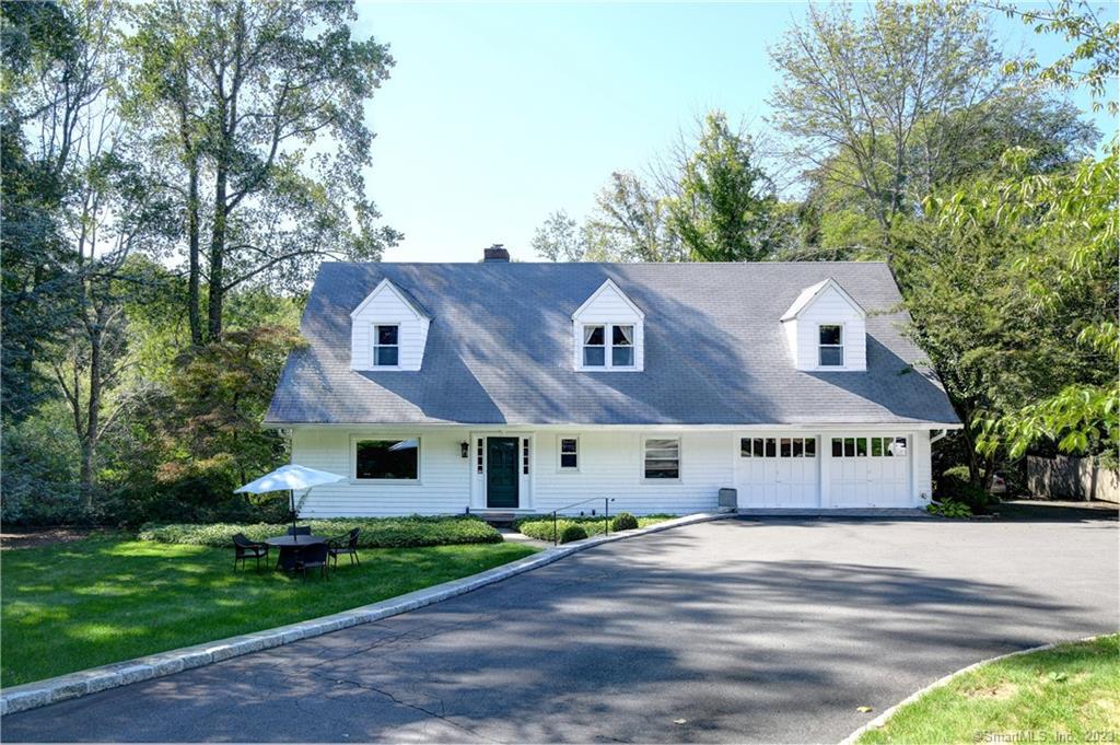 336 West Lane Ridgefield, CT 06877 - Photo 1 of 1 a view of a white house with a big yard and large trees