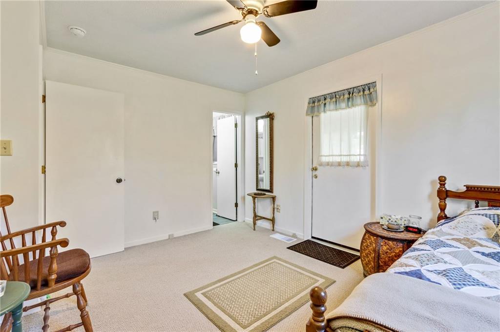 4339 Rex Road Rex, GA 30273 - Photo 14 of 23 a bedroom with a bed and a chandelier