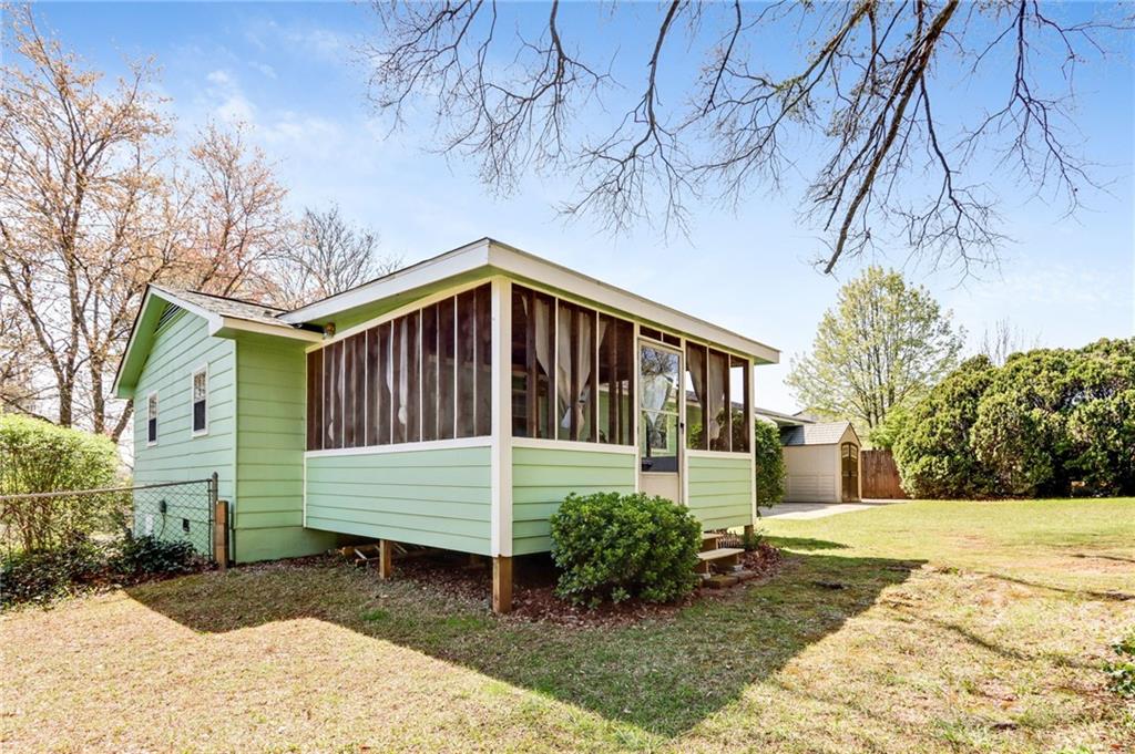 4339 Rex Road Rex, GA 30273 - Photo 18 of 23 a front view of a house with garden