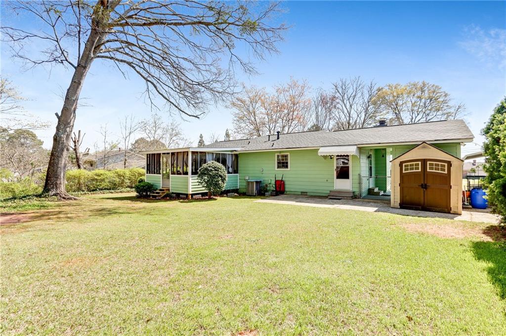 4339 Rex Road Rex, GA 30273 - Photo 19 of 23 a front view of a house with a yard and garage