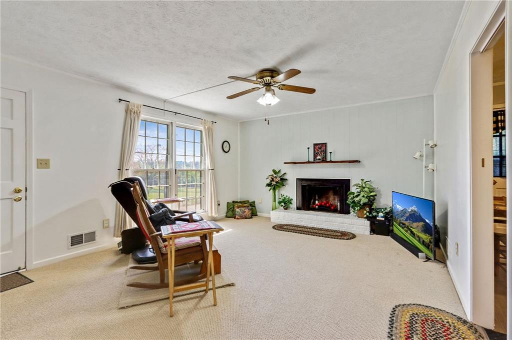 4339 Rex Road Rex, GA 30273 - Photo 2 of 23 a living room with furniture and a fireplace