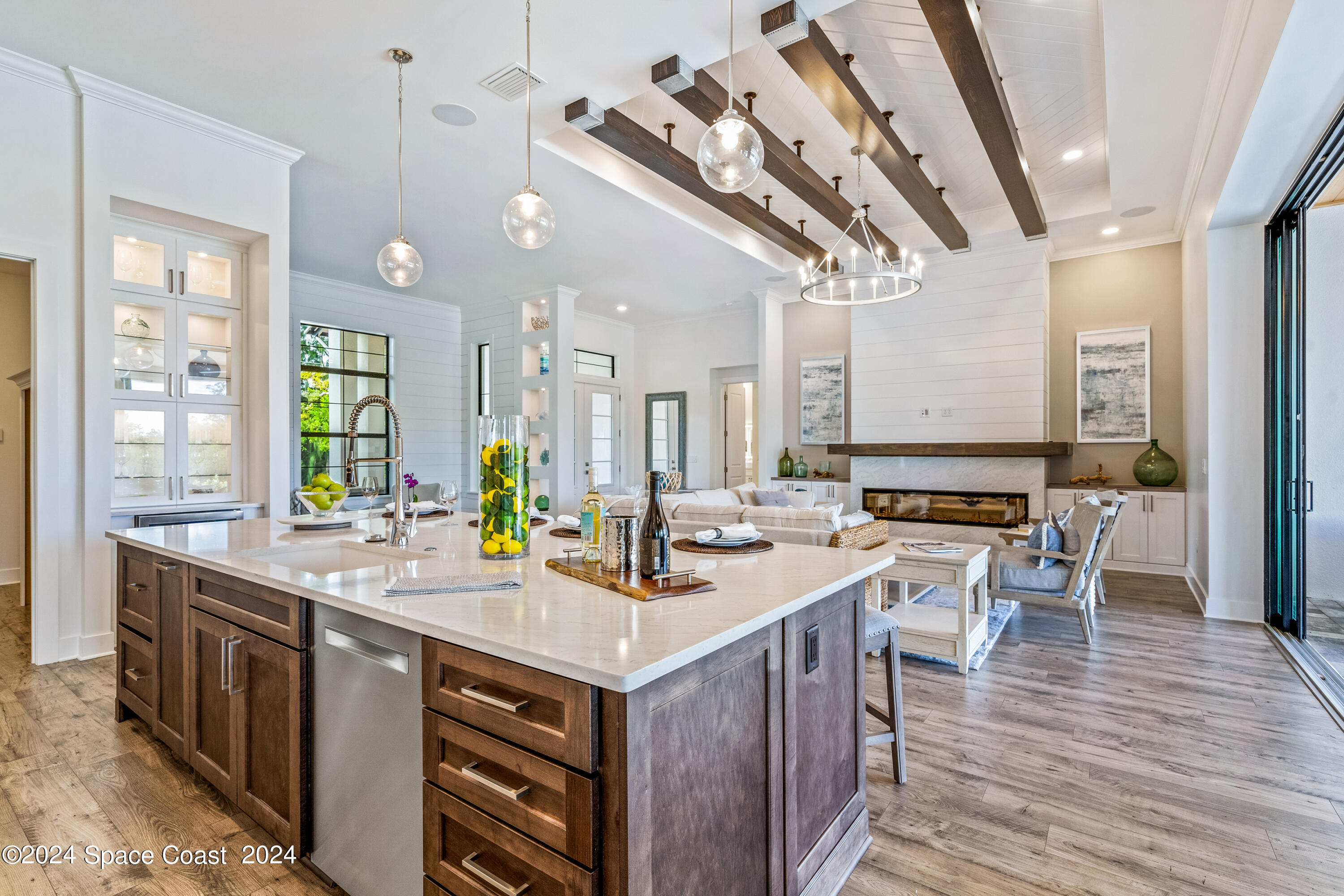 Undisclosed Address Vero Beach, FL 32963 - Photo 13 of 36 a kitchen with stainless steel appliances granite countertop a sink a stove and a wooden floors