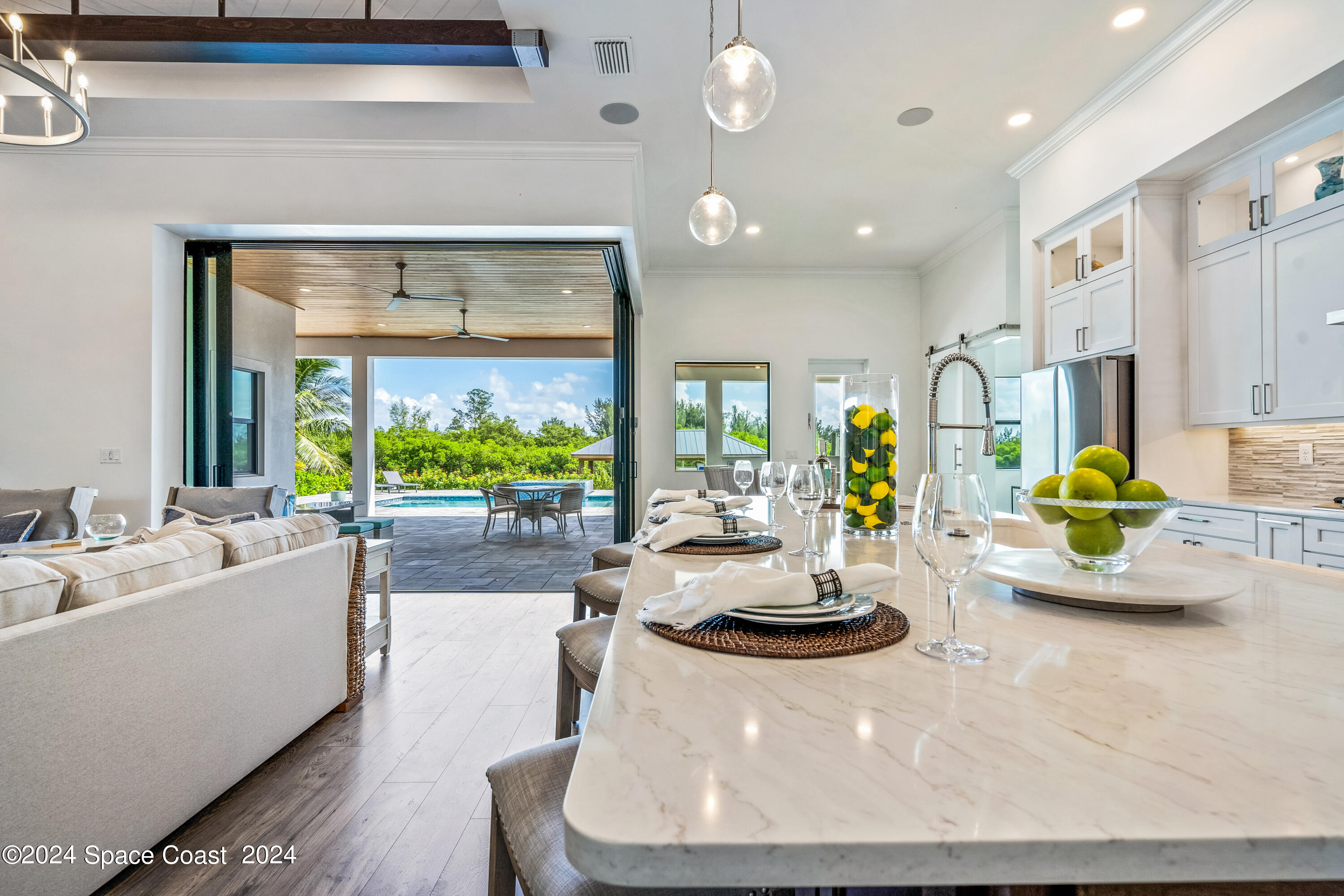 Undisclosed Address Vero Beach, FL 32963 - Photo 16 of 36 a dining room with furniture and a large window