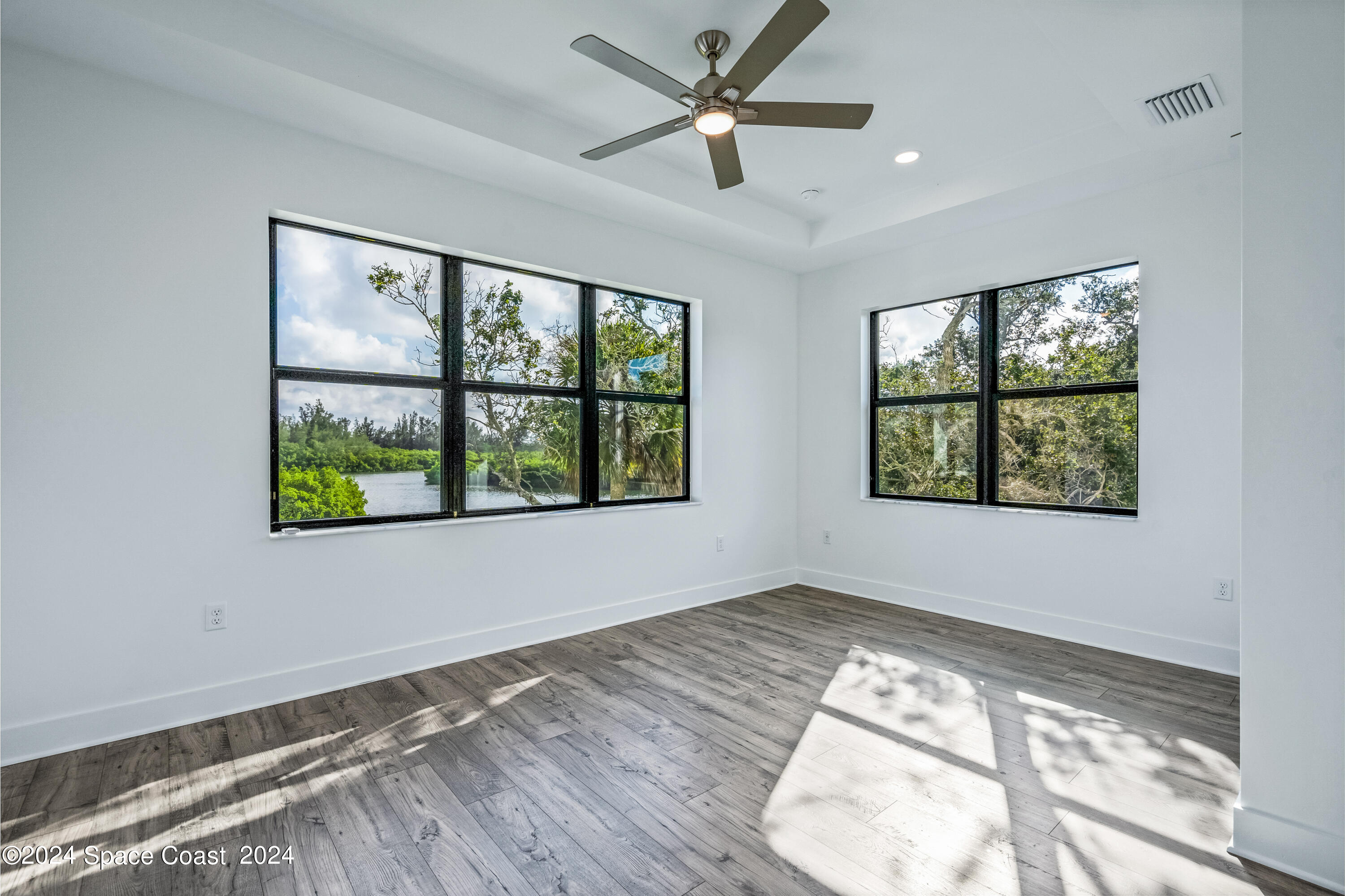 Undisclosed Address Vero Beach, FL 32963 - Photo 29 of 36 wooden floor in an empty room with a window