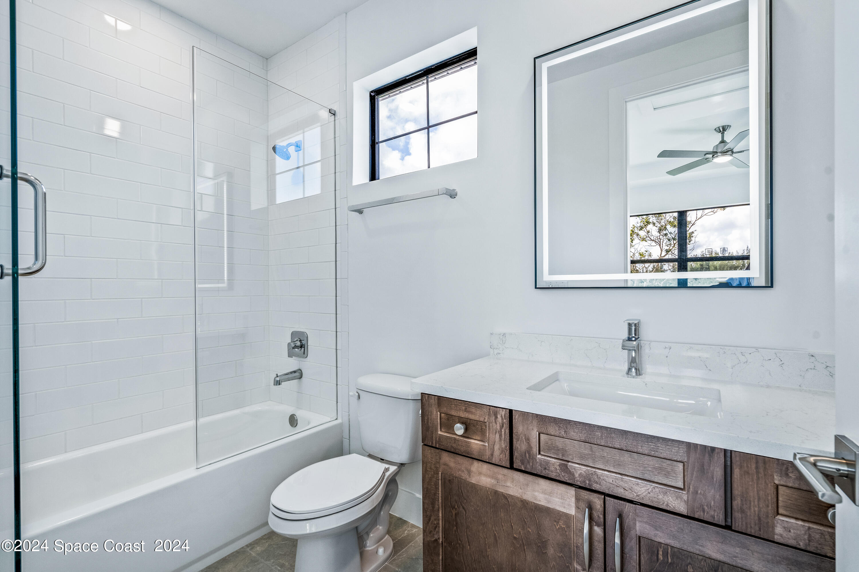 Undisclosed Address Vero Beach, FL 32963 - Photo 31 of 36 a bathroom with a sink a toilet and shower