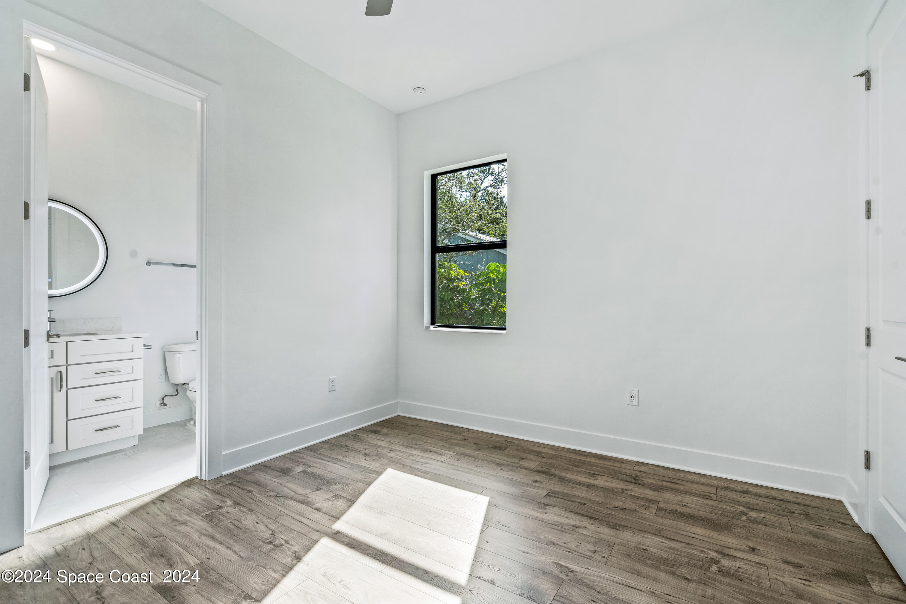 Undisclosed Address Vero Beach, FL 32963 - Photo 32 of 36 an empty room with a window and cabinet
