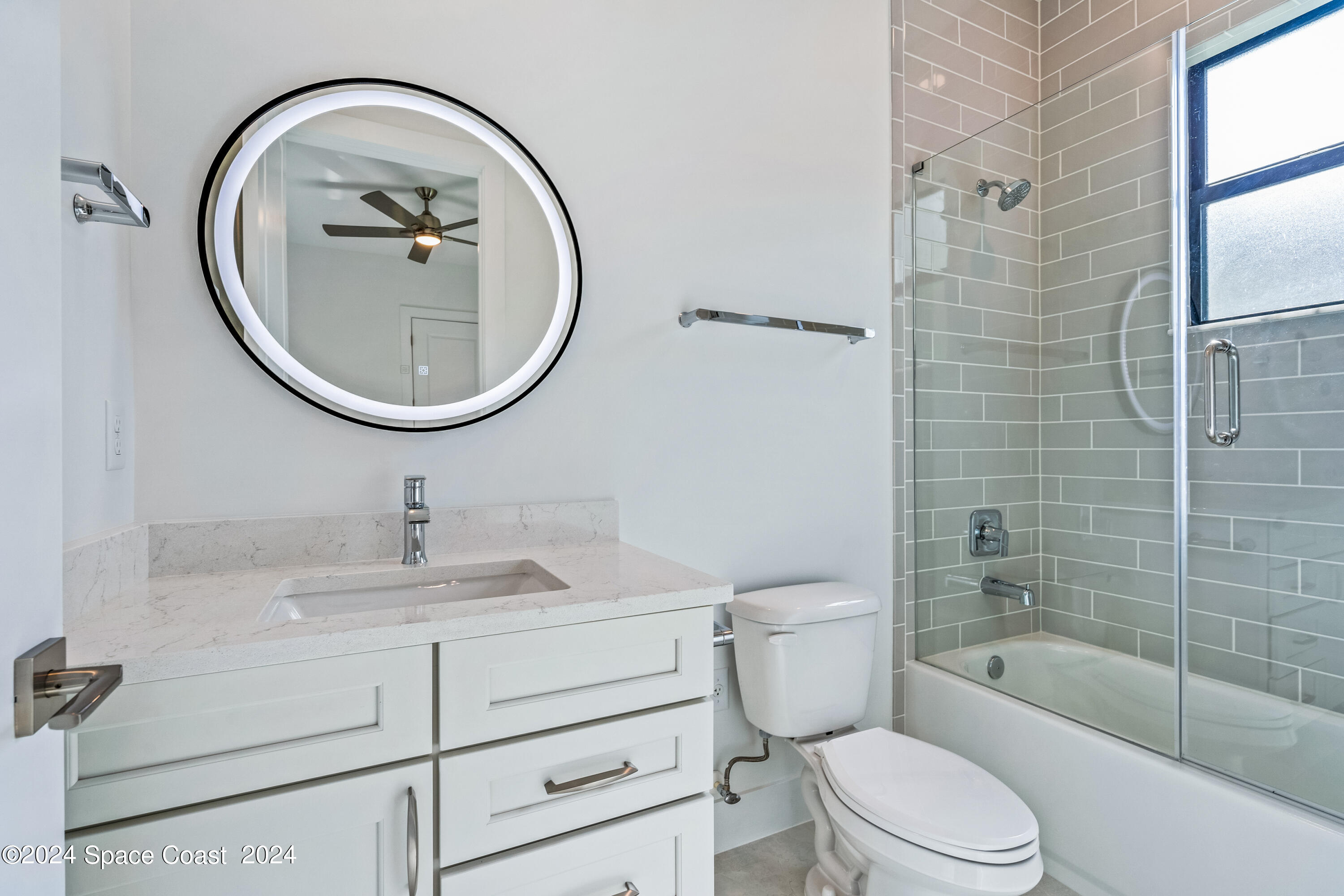 Undisclosed Address Vero Beach, FL 32963 - Photo 34 of 36 a bathroom with a sink a toilet and a mirror