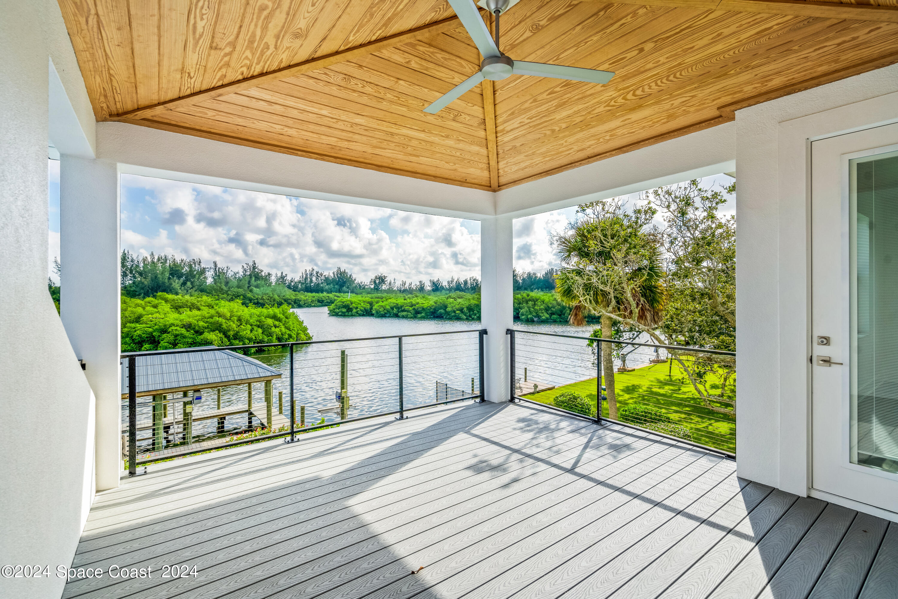 Undisclosed Address Vero Beach, FL 32963 - Photo 35 of 36 a view of a patio with wooden floor
