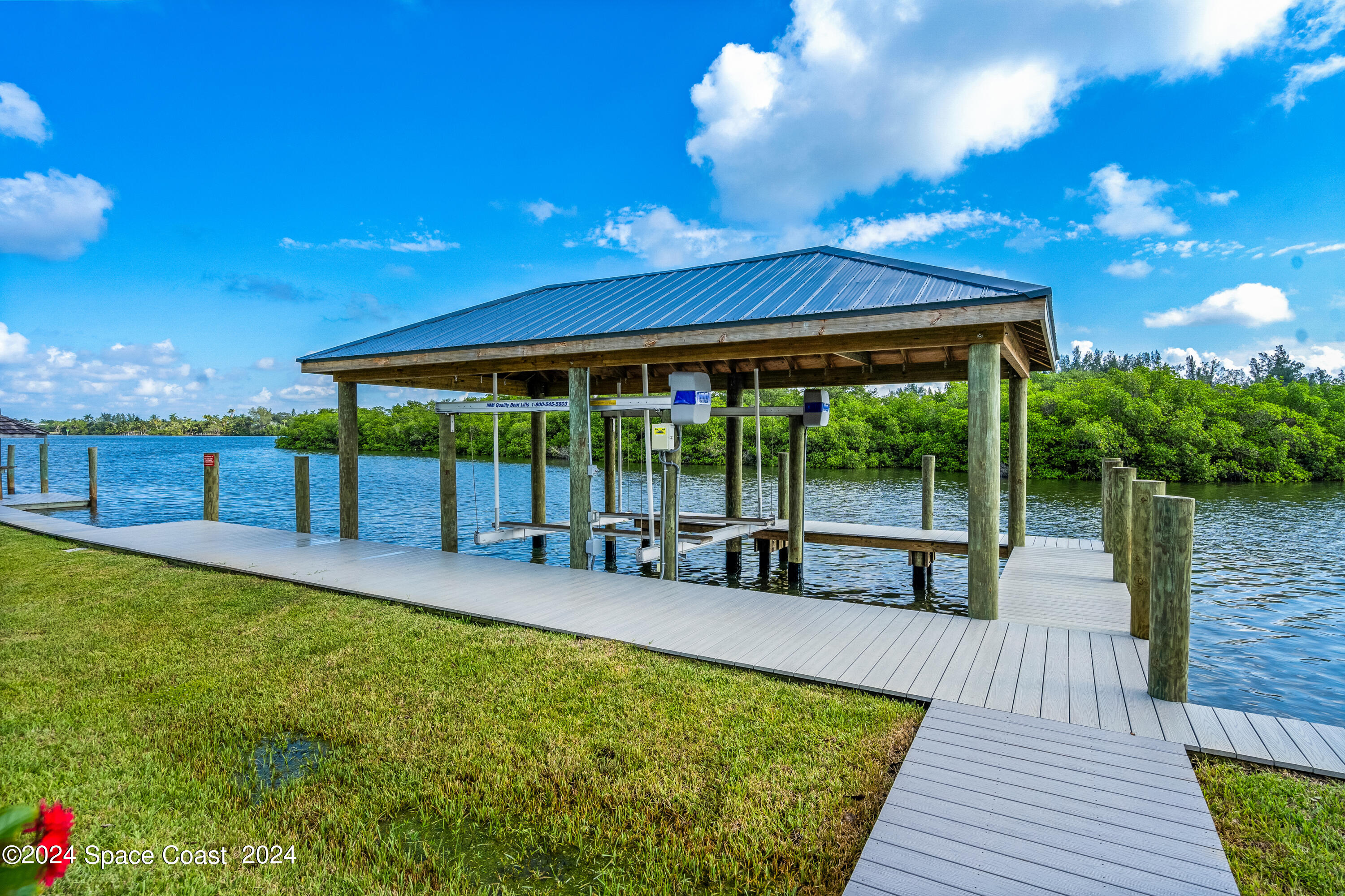 Undisclosed Address Vero Beach, FL 32963 - Photo 36 of 36 a view of a swimming pool with a patio and a garden