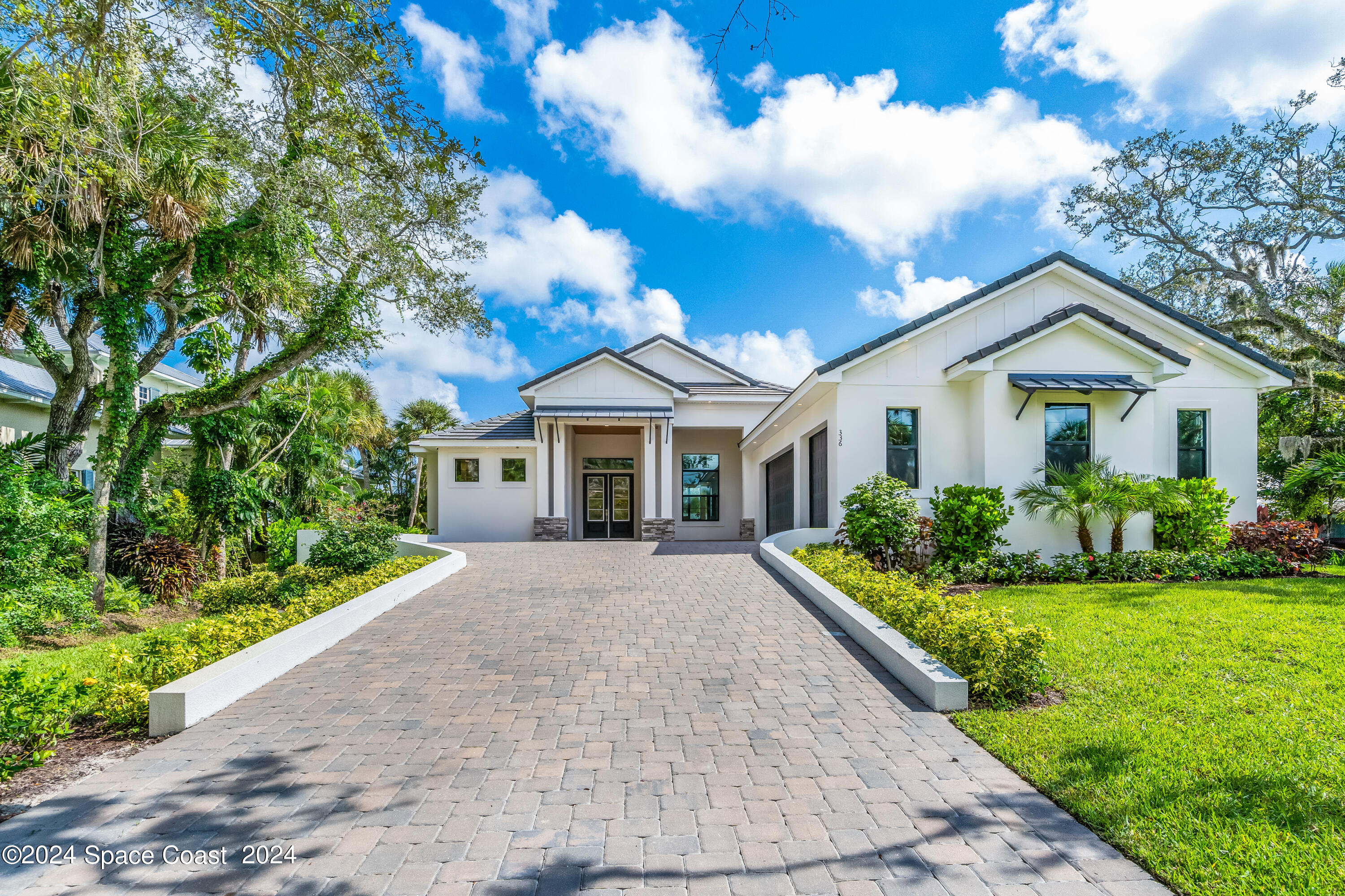 Undisclosed Address Vero Beach, FL 32963 - Photo 6 of 36 a front view of house with yard and green space