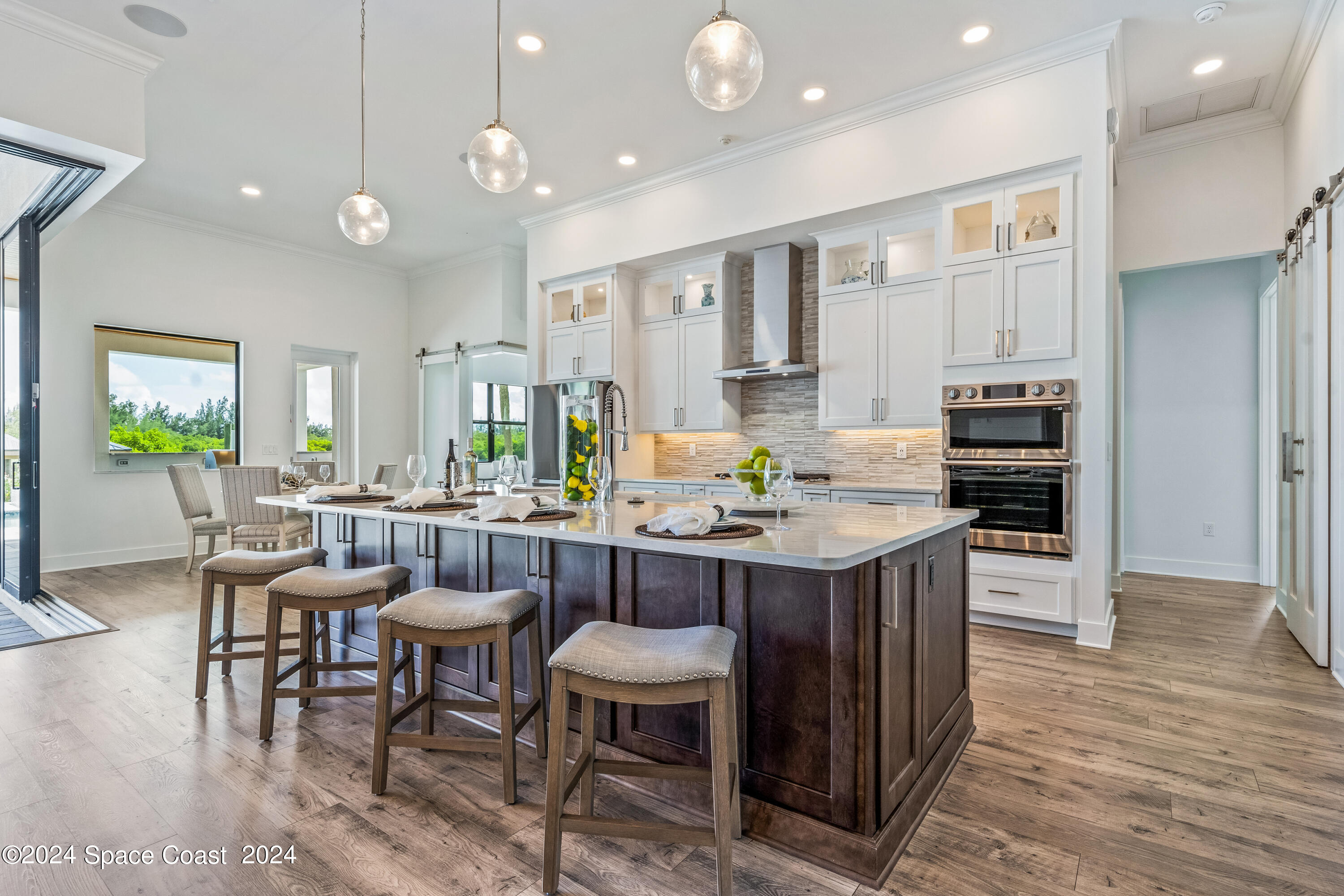 Undisclosed Address Vero Beach, FL 32963 - Photo 10 of 36 a kitchen with a table and chairs in it