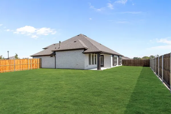 a house with garden in front of it