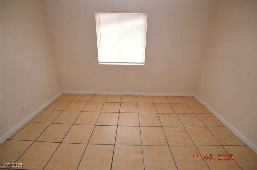 3240 North Mary Dee Avenue, Unit D North Las Vegas, NV 89030 - Photo 8 of 10 Spare room with light tile patterned floors