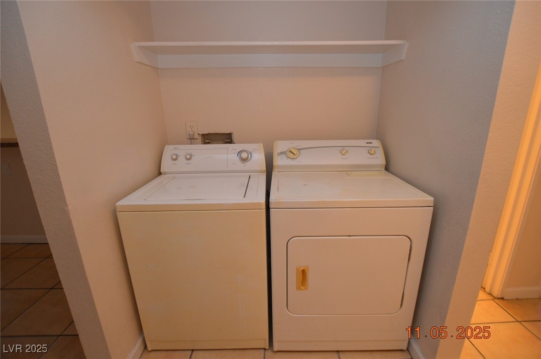 3240 North Mary Dee Avenue, Unit D North Las Vegas, NV 89030 - Photo 10 of 10 Washroom with light tile patterned flooring and separate washer and dryer