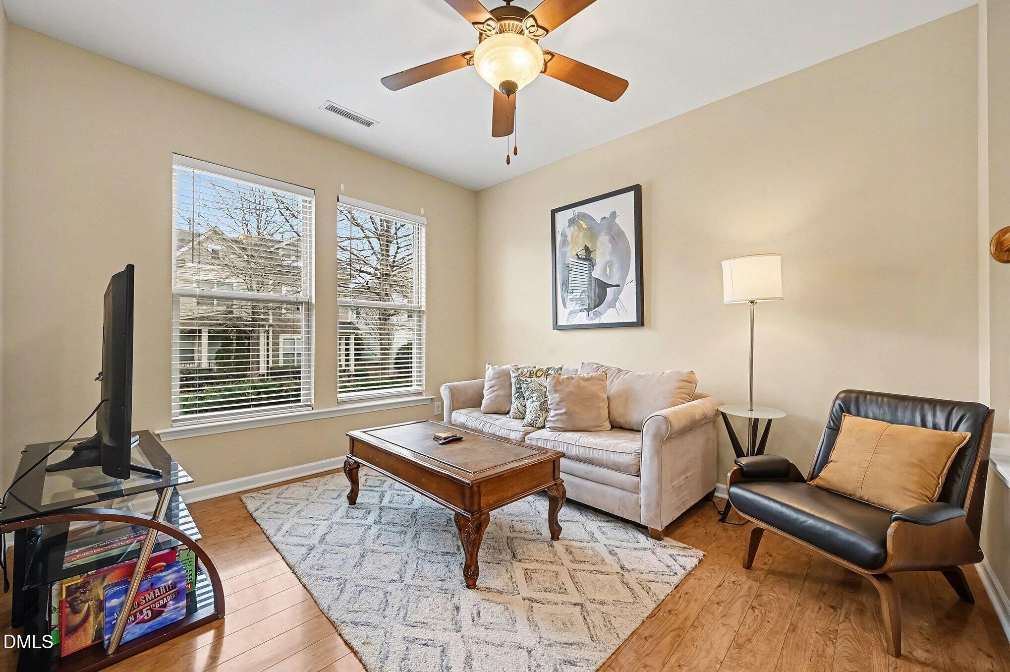 106 Kiley Street Chapel Hill, NC 27516 - Photo 4 of 17 a living room with furniture and two window