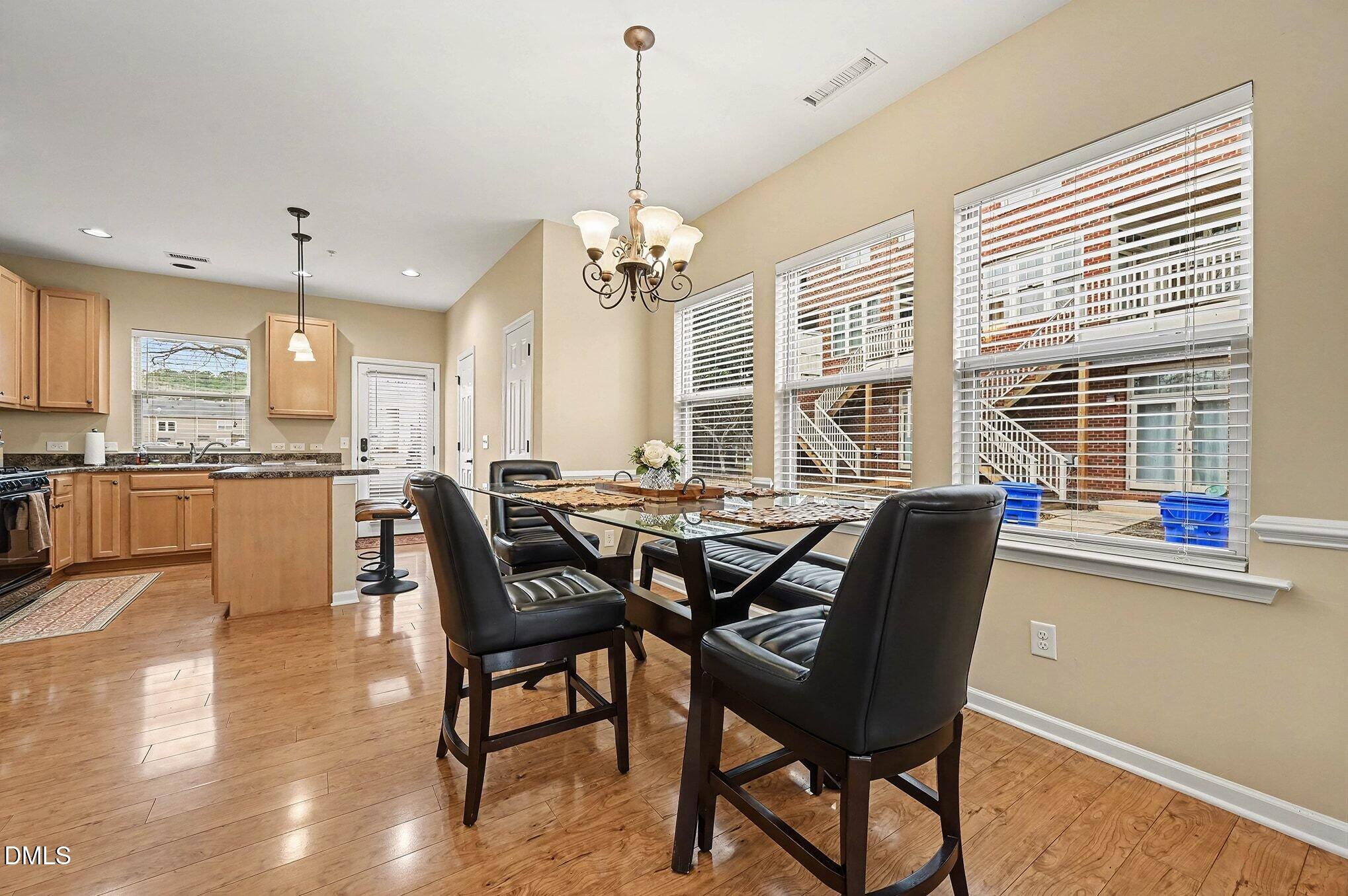 106 Kiley Street Chapel Hill, NC 27516 - Photo 6 of 17 a view of a dining room with furniture window and outside view