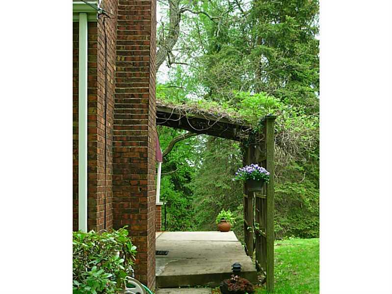 433 Edgewood Road Forest Hills, PA 15221 - Photo 21 of 25 Exterior Back. A grape arbor adorns the side portion of the back/side wrap-around upper patio.