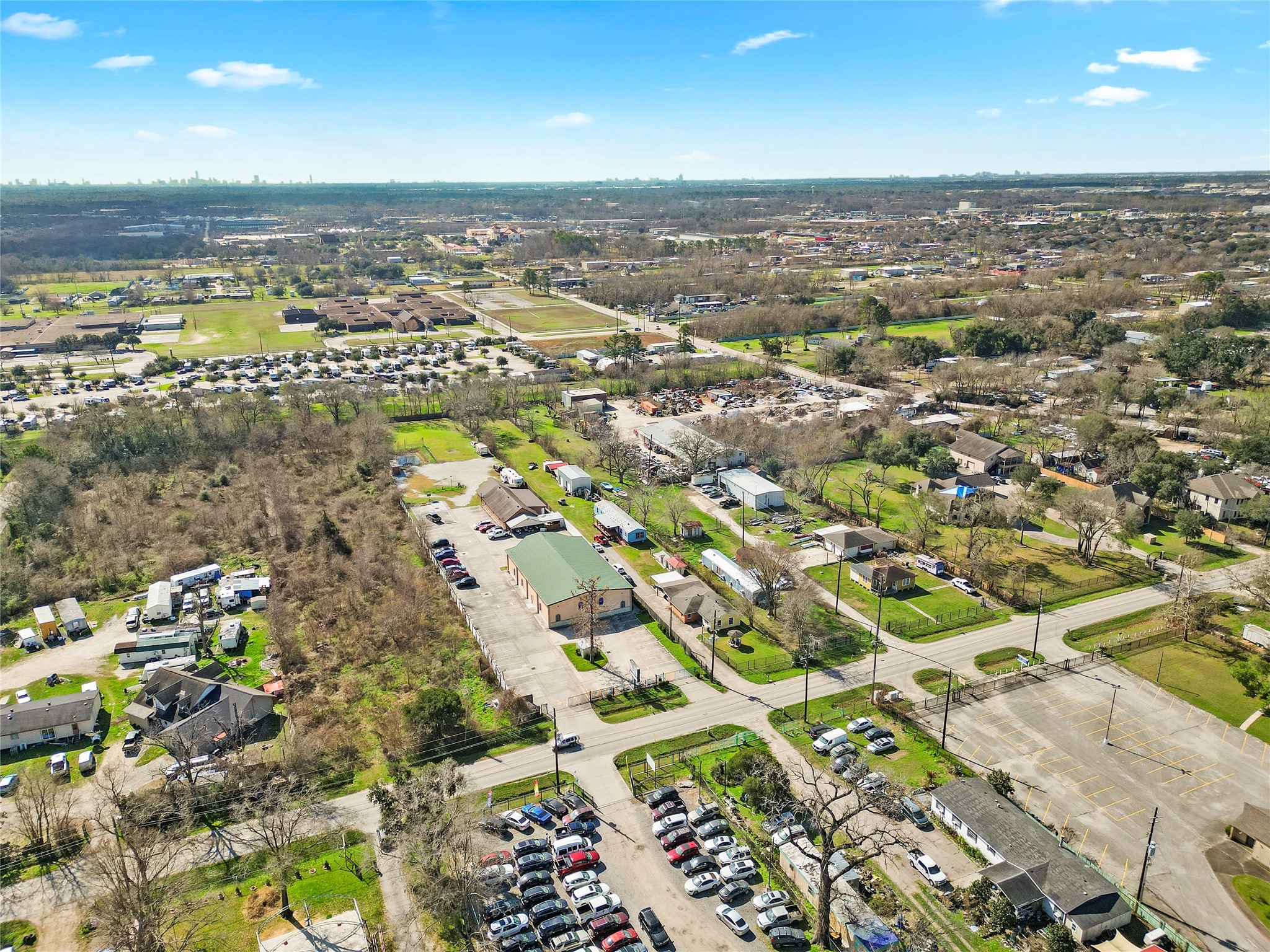 3127 Frick Road Houston, TX 77038 - Photo 3 of 16 an aerial view of a city with lots of residential buildings