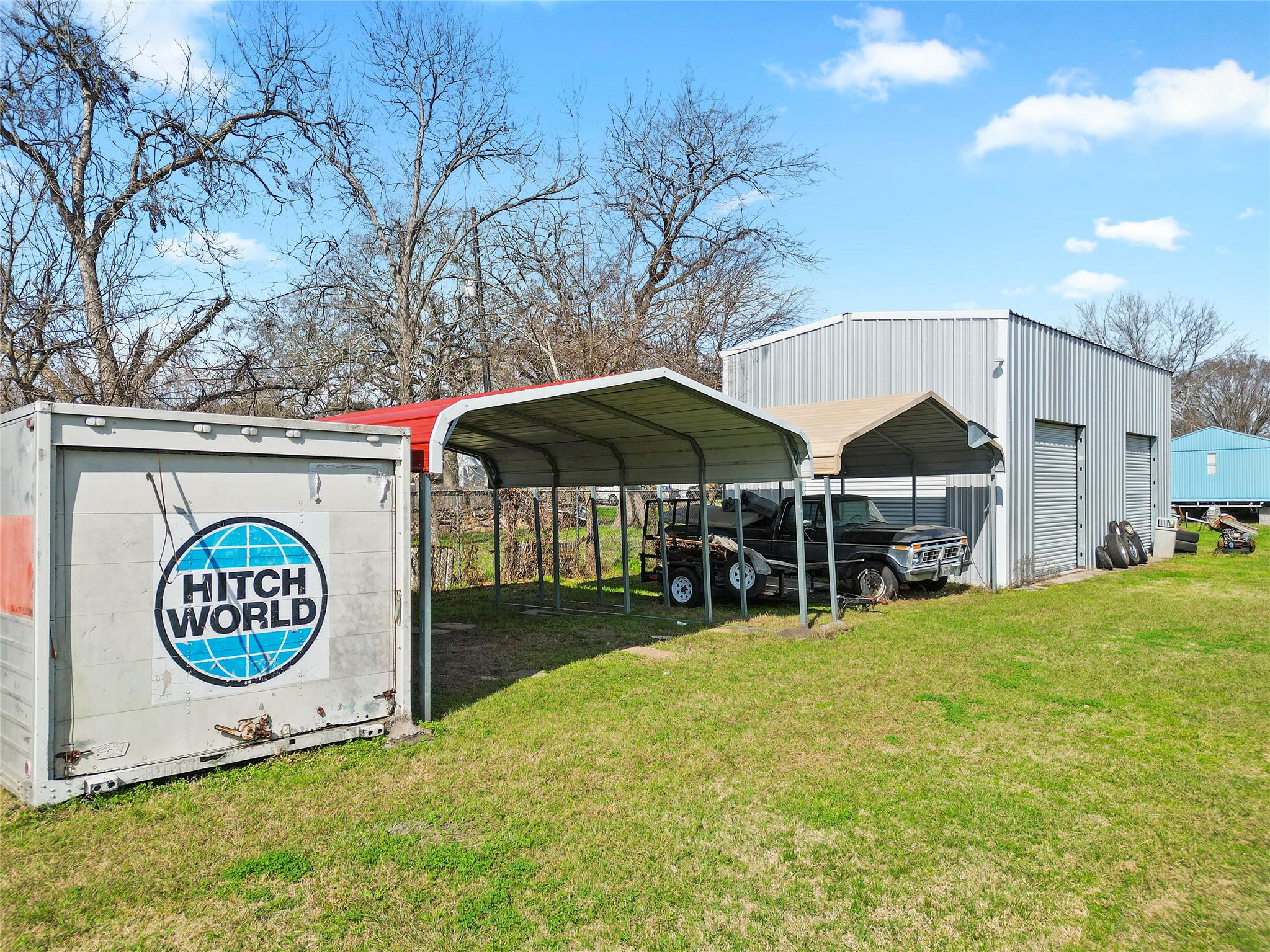 3127 Frick Road Houston, TX 77038 - Photo 7 of 16 a view of a house with a backyard and a tree