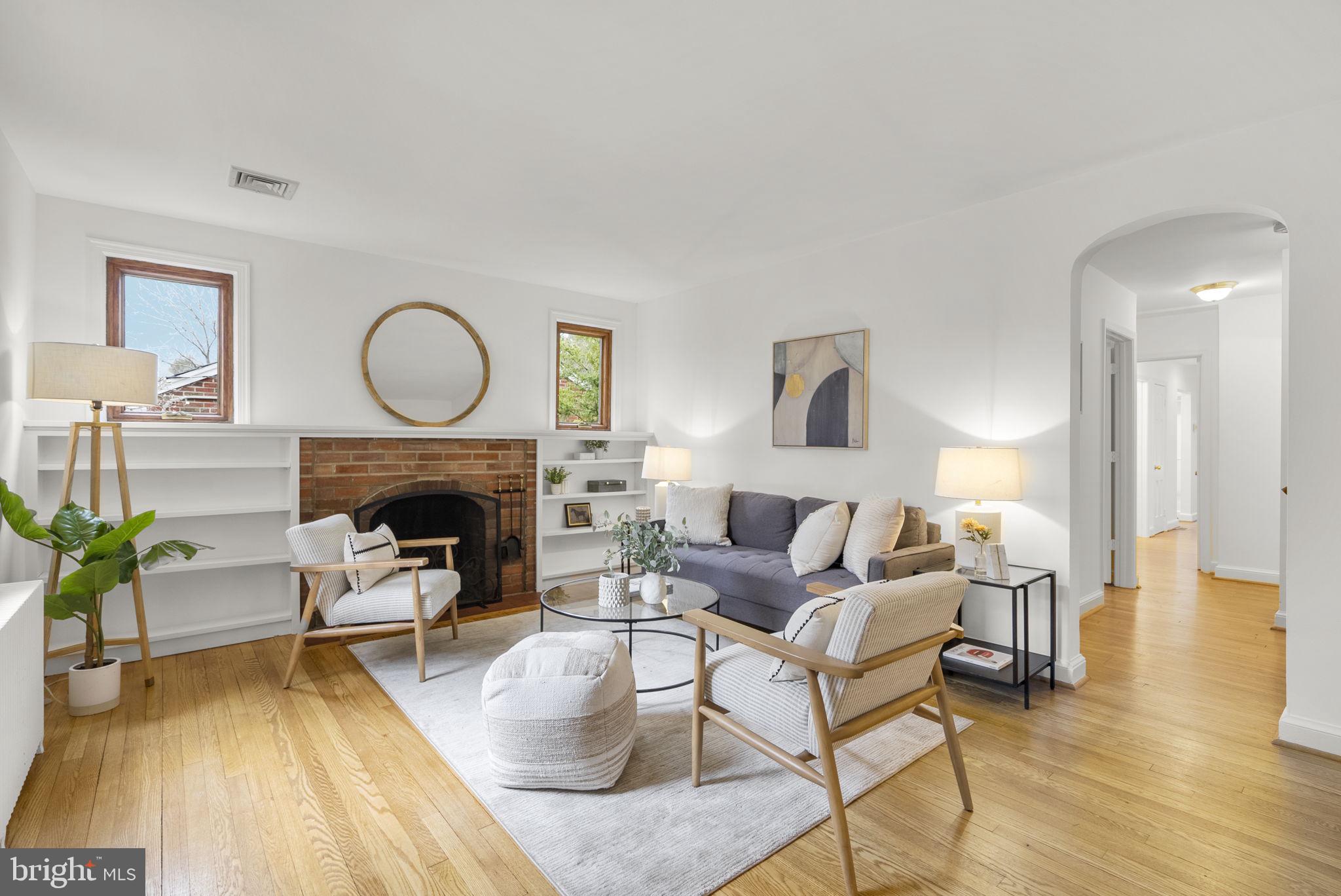 709 Woodside Parkway Silver Spring, MD 20910 - Photo 5 of 29 Living room with wood burning fireplace
