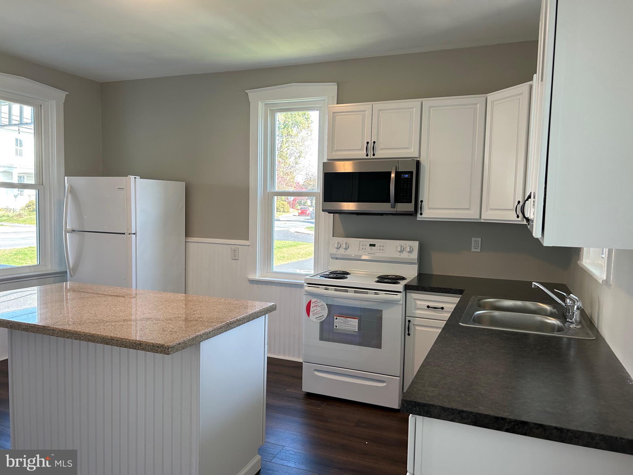 2116 Main Street Lititz, PA 17543 - Photo 18 of 49 a kitchen with kitchen island a stove a sink and a microwave