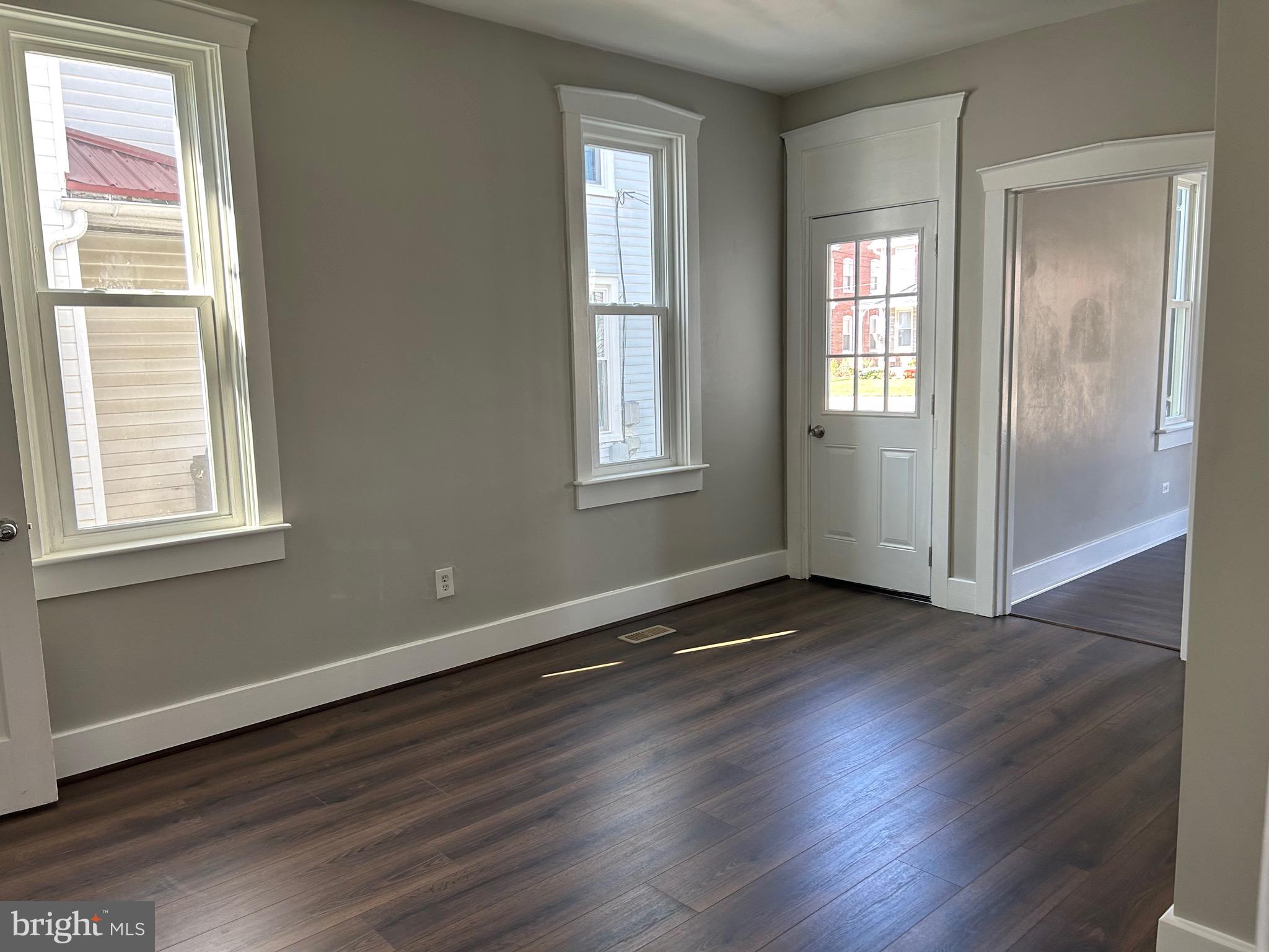2116 Main Street Lititz, PA 17543 - Photo 20 of 49 an empty room with wooden floor and windows