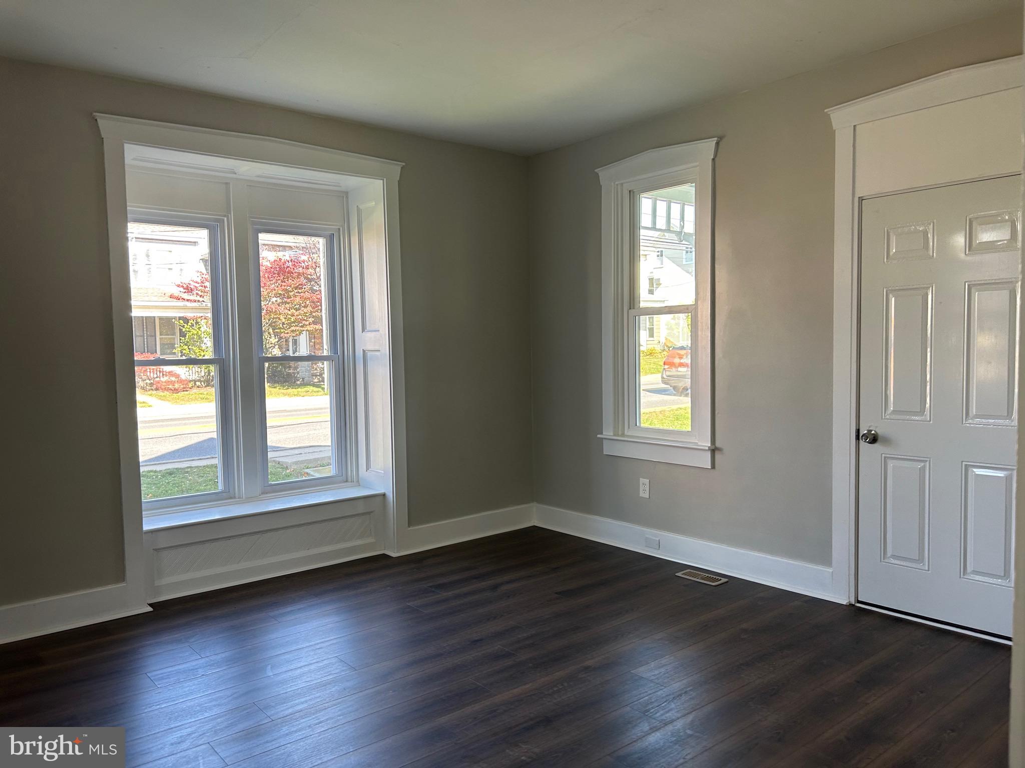 2116 Main Street Lititz, PA 17543 - Photo 25 of 49 an empty room with wooden floor and windows