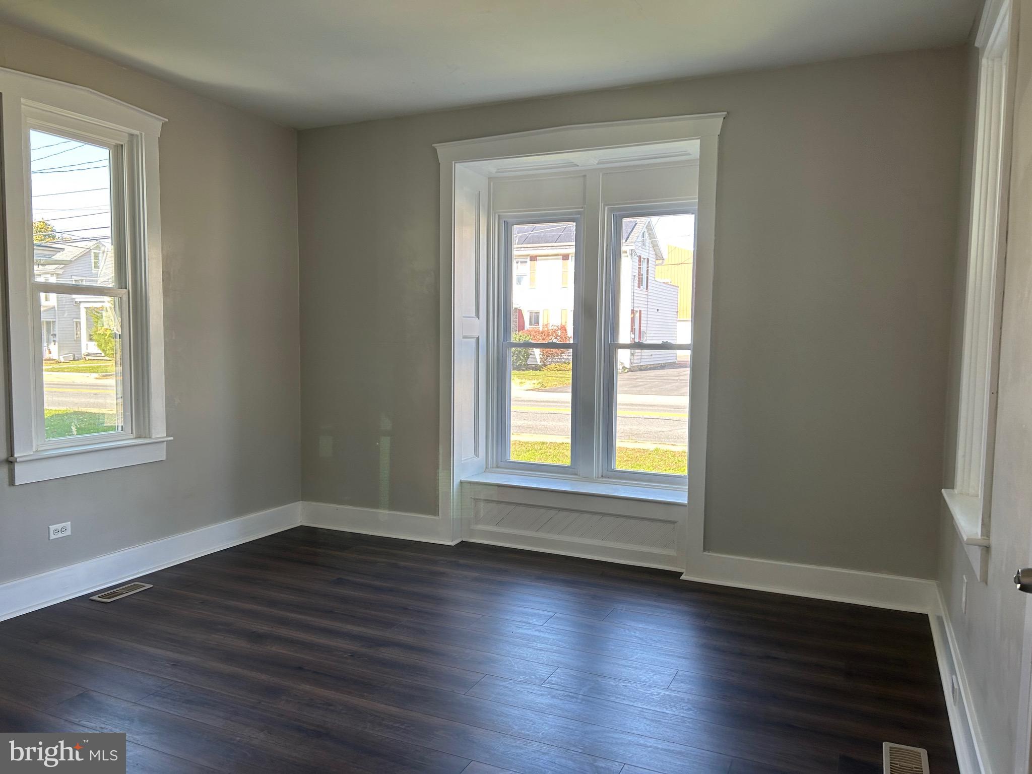2116 Main Street Lititz, PA 17543 - Photo 26 of 49 an empty room with wooden floor and windows