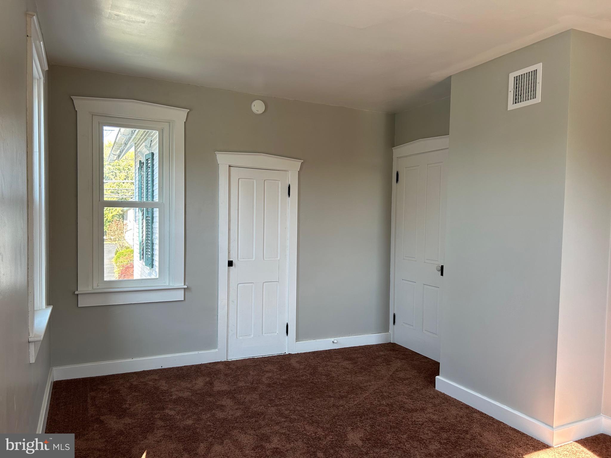 2116 Main Street Lititz, PA 17543 - Photo 31 of 49 a view of an empty room with wooden floor and a window