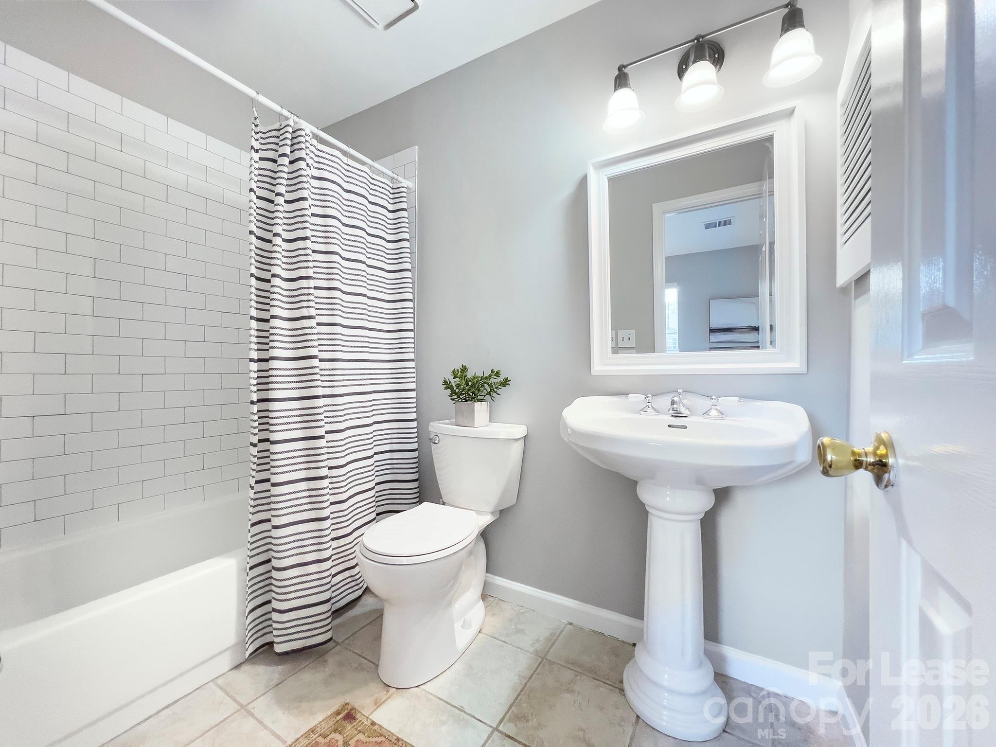 8268 Golf Ridge Drive Charlotte, NC 28277 - Photo 18 of 24 a bathroom with a sink toilet and shower
