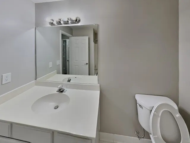 a bathroom with a toilet and a sink