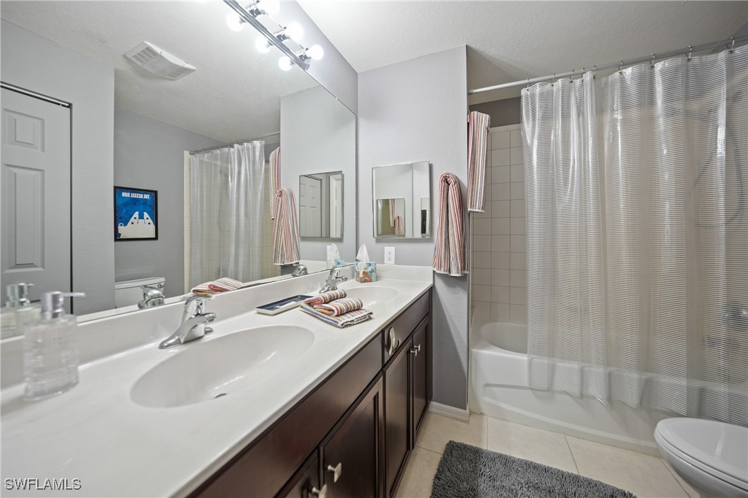 950 Moody Road, Unit 140 North Fort Myers, FL 33903 - Photo 12 of 46 a bathroom with double vanity sink and a mirror