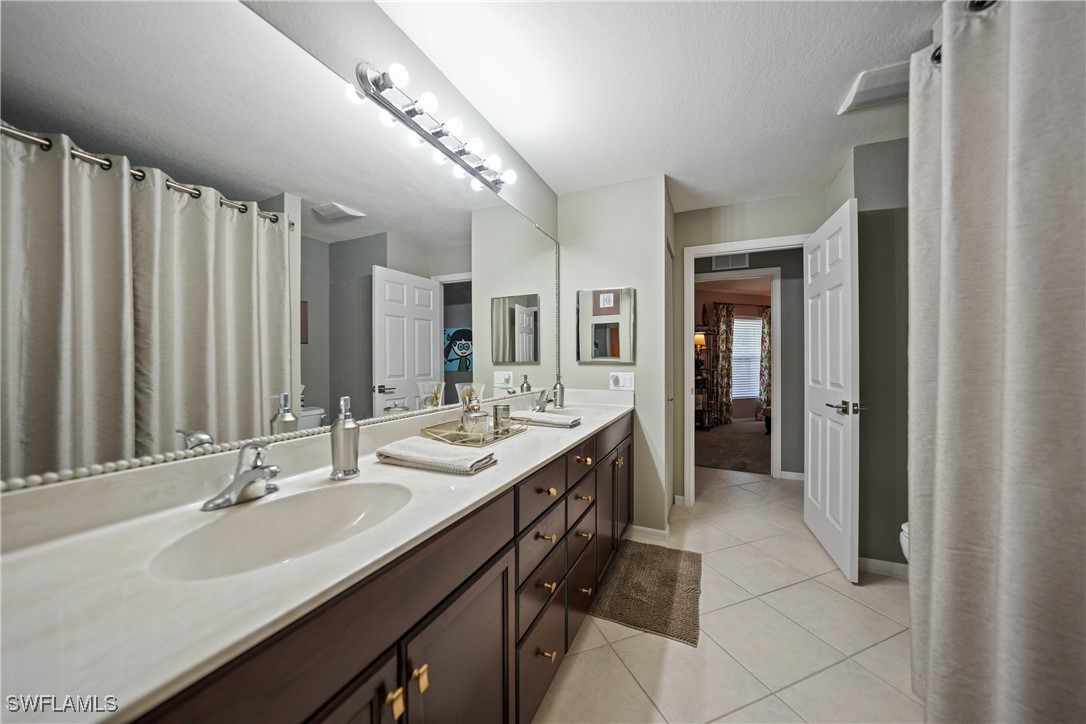 950 Moody Road, Unit 140 North Fort Myers, FL 33903 - Photo 15 of 46 a bathroom with double sink and a mirror